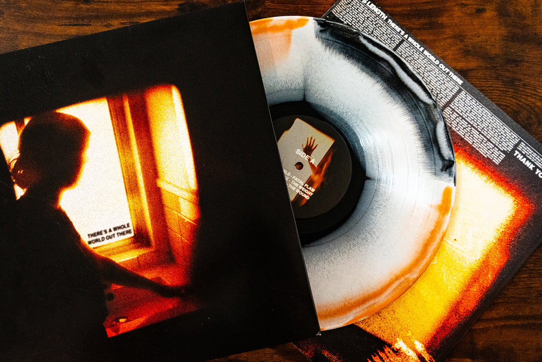 There’s A Whole World Out There - Black, White & Orange Aside/Bside LP