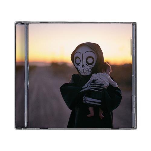 CD case featuring a figure in a skull mask holding a small child against a sunset backdrop.